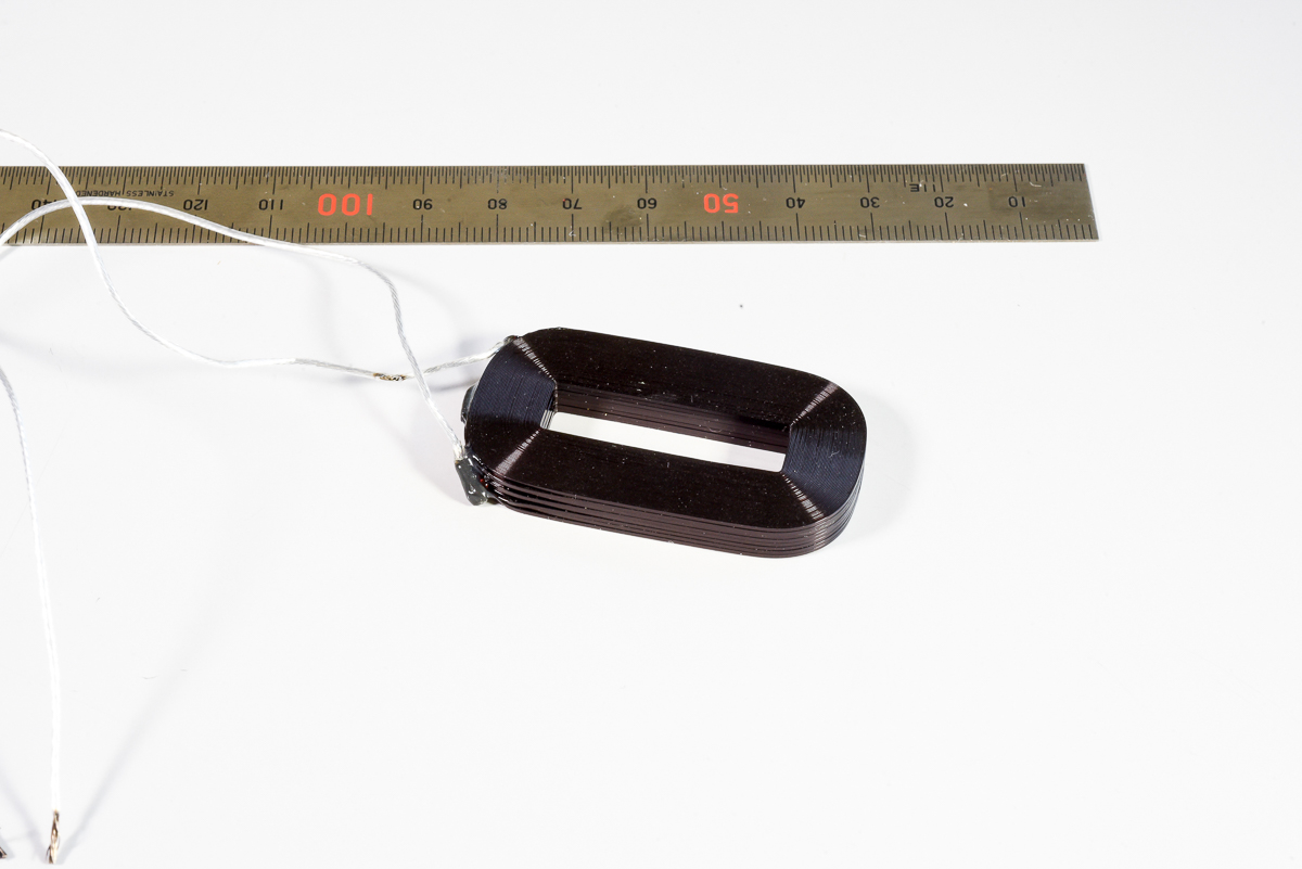 Flat coil with outside lead wire and maximum fill factor